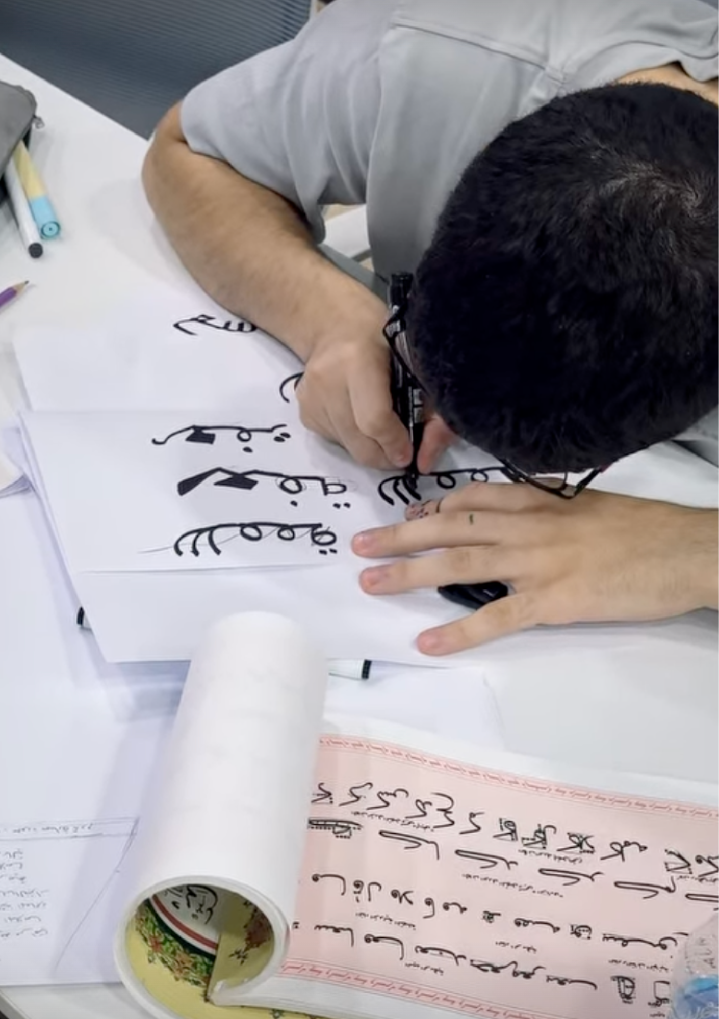 أعمال المشاركين — تمرين خط عربي خلال الورشة